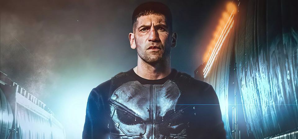 Jon Bernthal's Frank Castle standing in fog and floodlight in his Punisher body armour